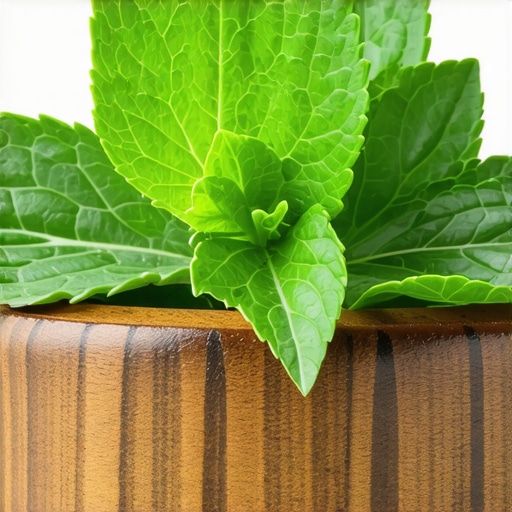 Close-up of fresh mint leaves in a rustic wooden bowl, vibrant green color, natural lighting